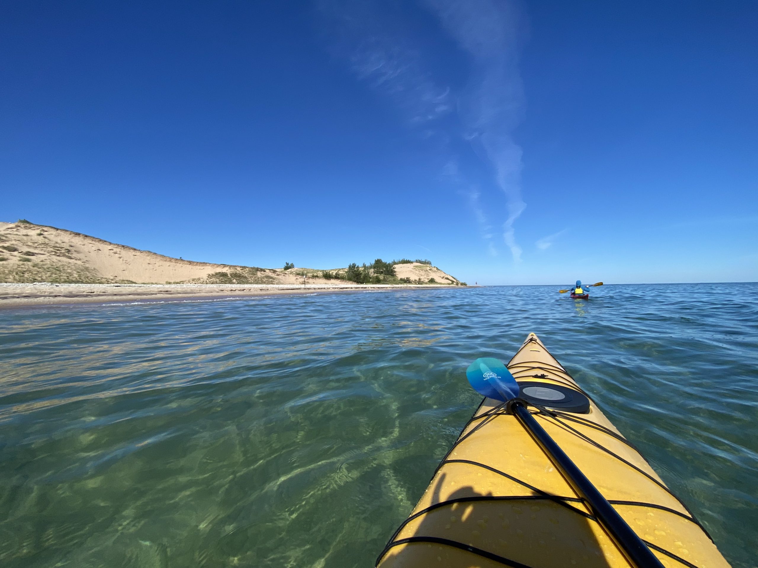 Kayaking in Lake Michigan at the Sleeping Bear Sand Dunes on a bright sunny day